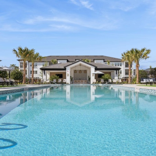 a pool with a building in the background