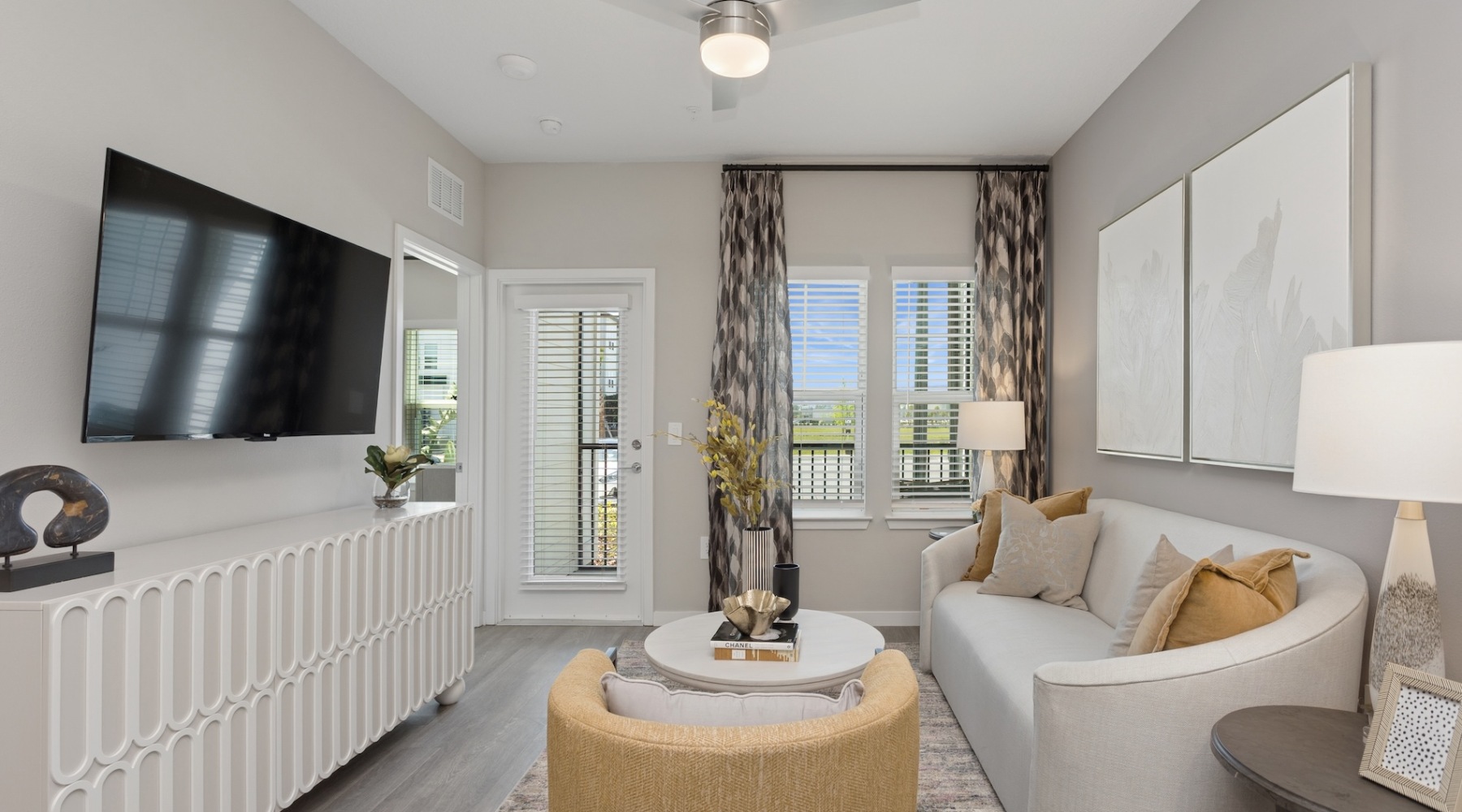 living room with a large window and open spaces
